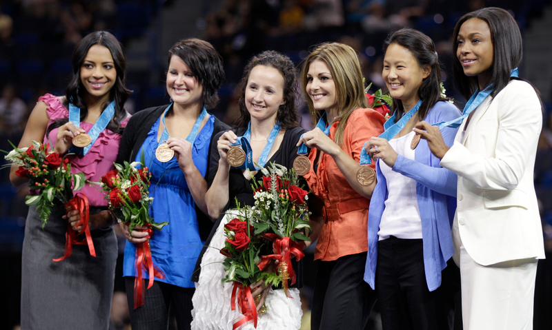 Tasha Schwikert, Elise Ray, Kristin Maloney, Jamie Dantzscher, Amy Chow, and Dominique Dawes at the 2010 bronze medal ceremony. Photo credit: Charles Krupa/AP